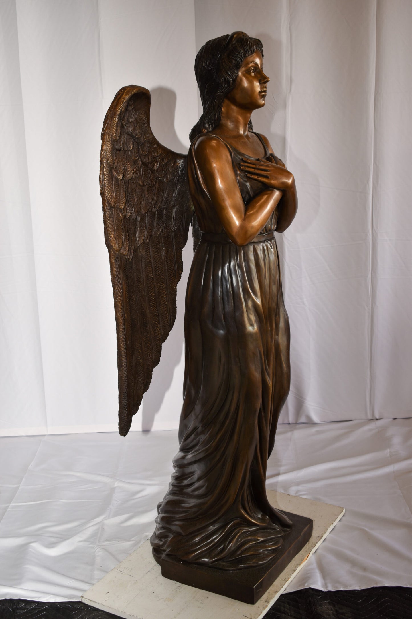 Angel Standing with her hands folded bronze Statue Size: 29" x 16" x 63"H
