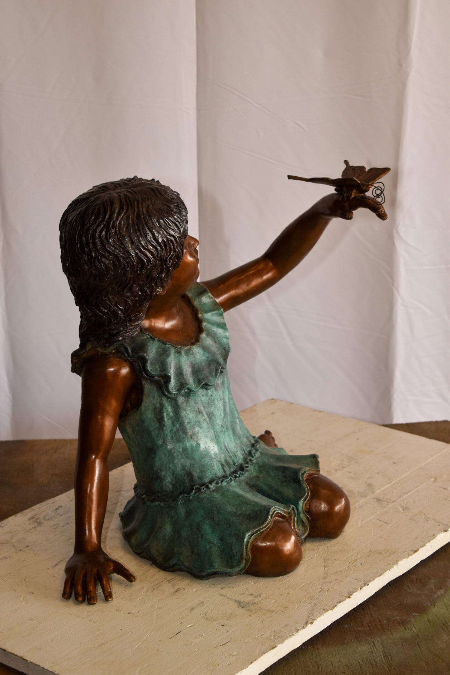 A Little Girl Playing with a Buterfly Bronze Statue 21" x 15" x 19"H
