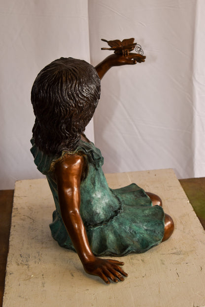 A Little Girl Playing with a Buterfly Bronze Statue 21" x 15" x 19"H