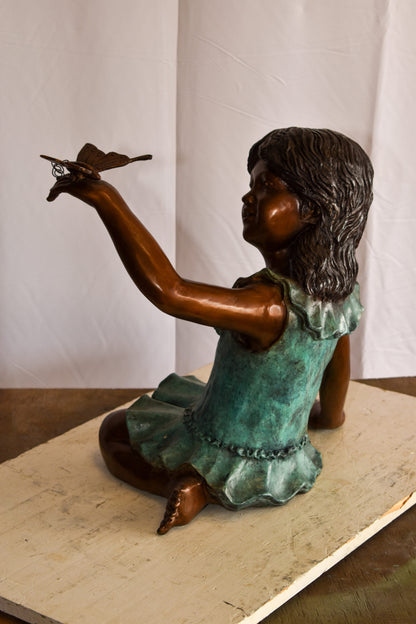 A Little Girl Playing with a Buterfly Bronze Statue 21" x 15" x 19"H