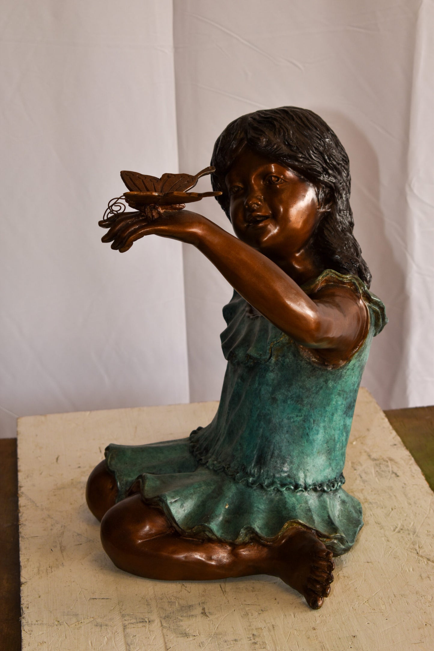 A Little Girl Playing with a Buterfly Bronze Statue 21" x 15" x 19"H
