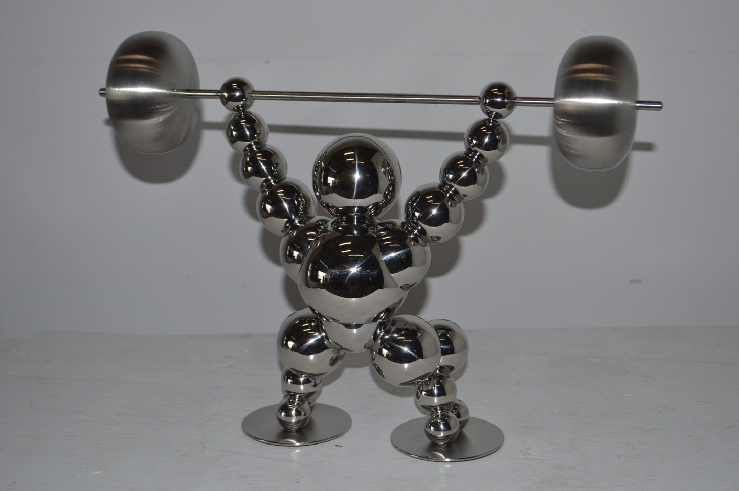Modern Art Weightlifter Catch Position Chrome Statue - Size: 20"L x 7"W x 15"H.