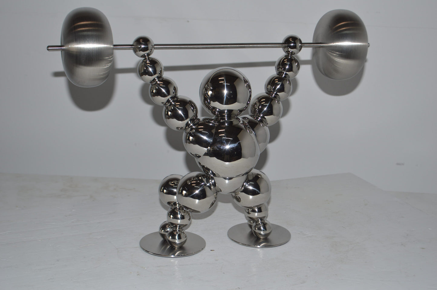 Modern Art Weightlifter Catch Position Chrome Statue - Size: 20"L x 7"W x 15"H.