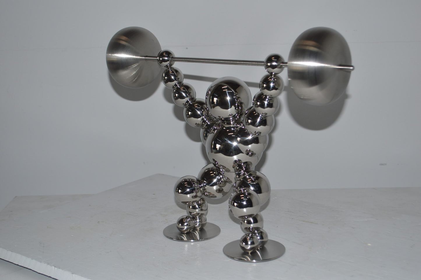 Modern Art Weightlifter Catch Position Chrome Statue - Size: 20"L x 7"W x 15"H.