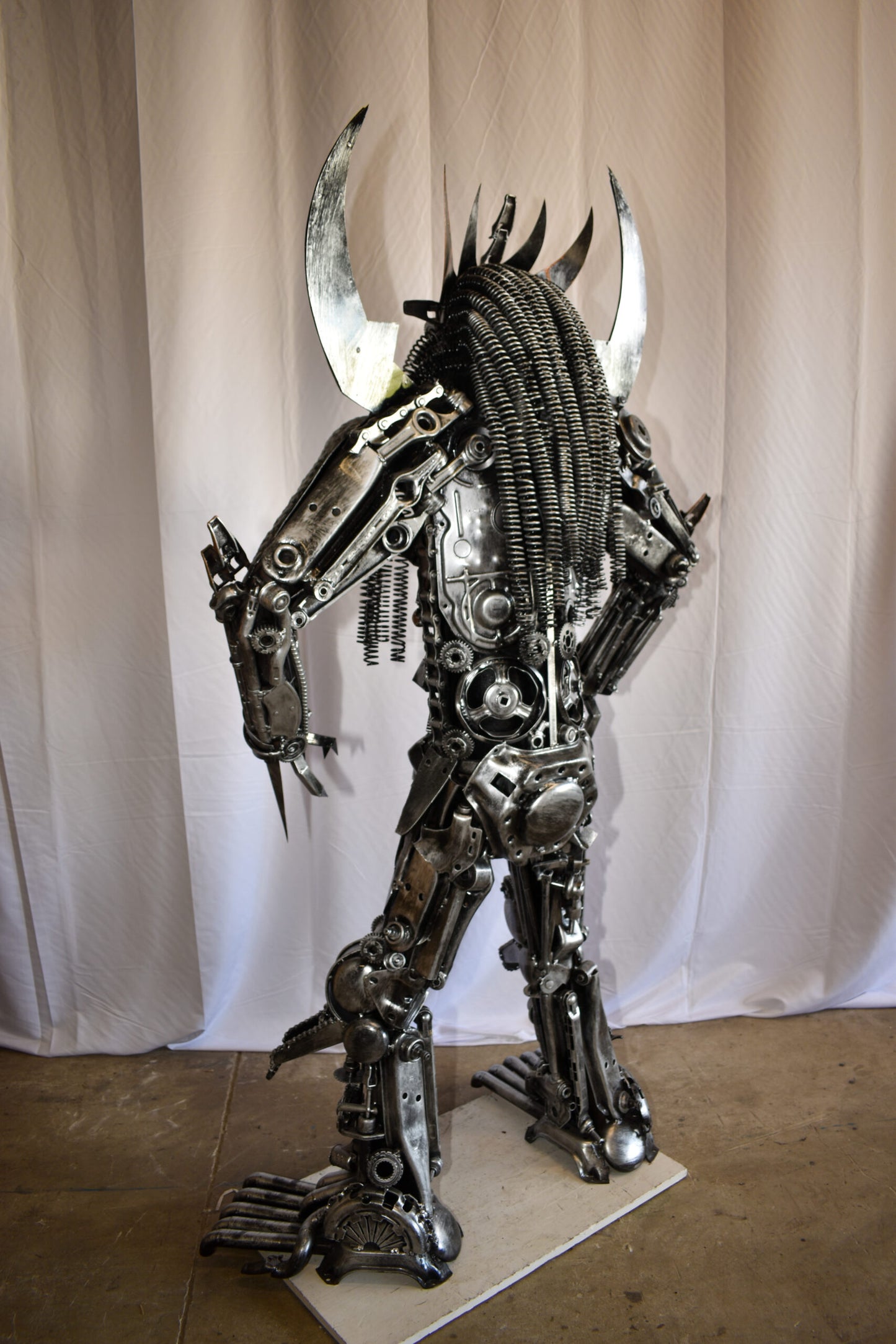 Colorfull impresive Statue of a warrier made of metal scraps 48" x 20" x 82"H