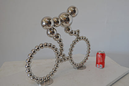 Modern Art Rider on His Bicycle Chrome Statue - Size: 22"L x 4"W x 17"H.