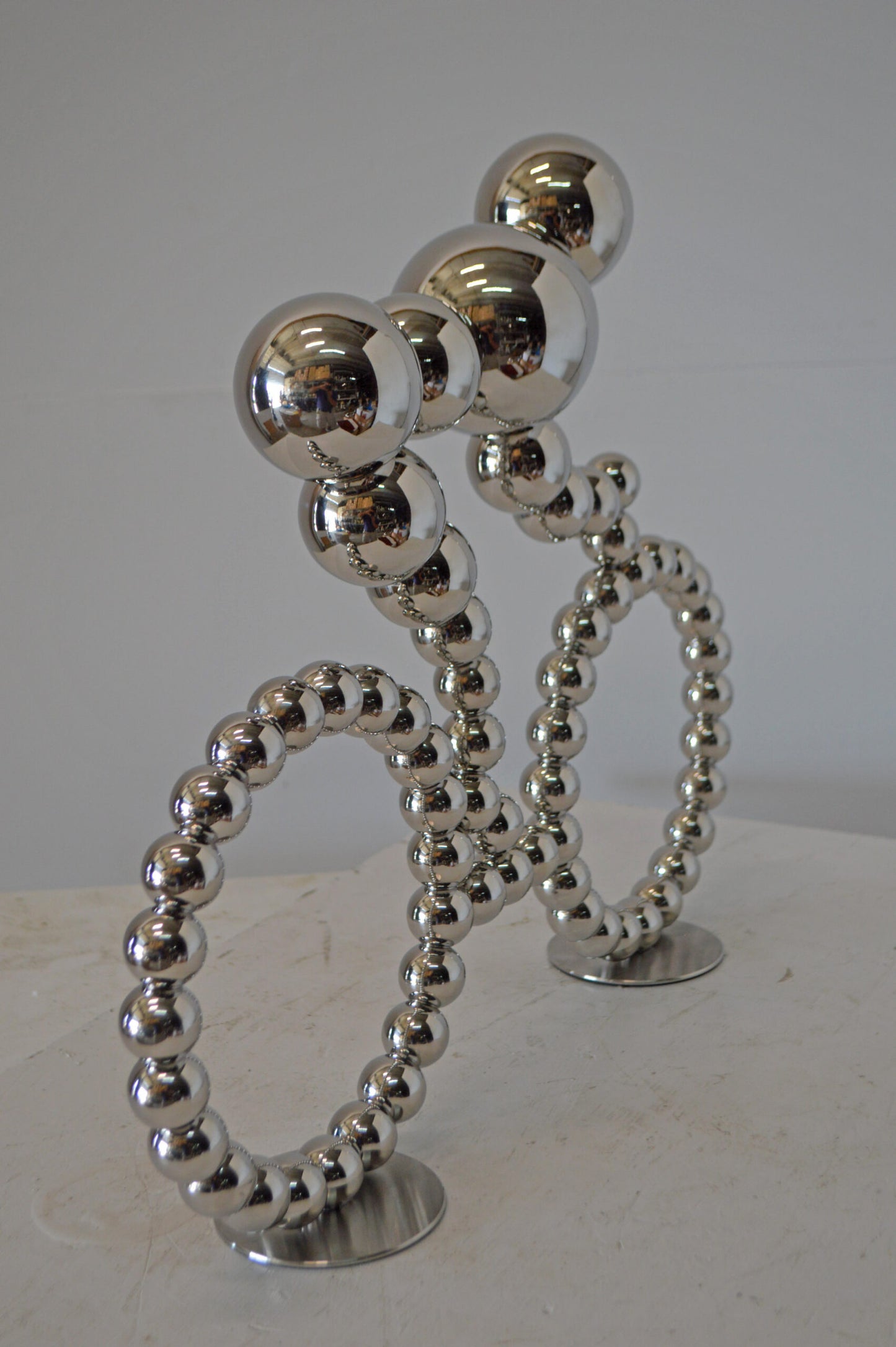 Modern Art Rider on His Bicycle Chrome Statue - Size: 22"L x 4"W x 17"H.