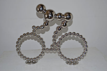 Modern Art Rider on His Bicycle Chrome Statue - Size: 22"L x 4"W x 17"H.
