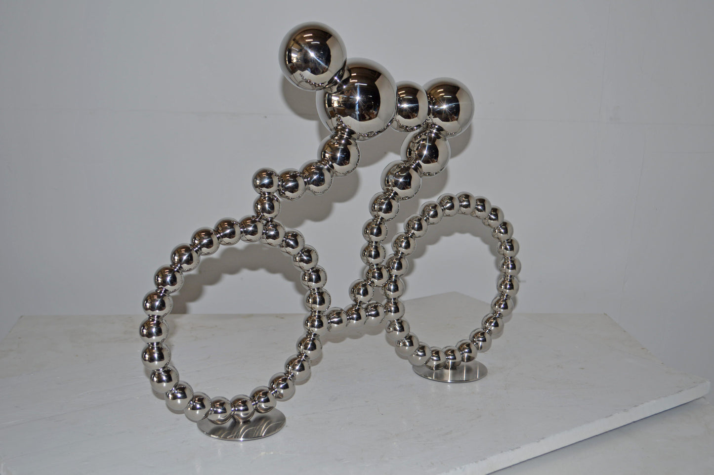 Modern Art Rider on His Bicycle Chrome Statue - Size: 22"L x 4"W x 17"H.