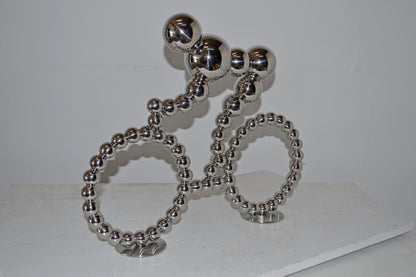 Modern Art Rider on His Bicycle Chrome Statue - Size: 22"L x 4"W x 17"H.