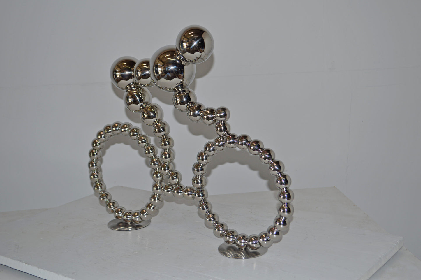 Modern Art Rider on His Bicycle Chrome Statue - Size: 22"L x 4"W x 17"H.
