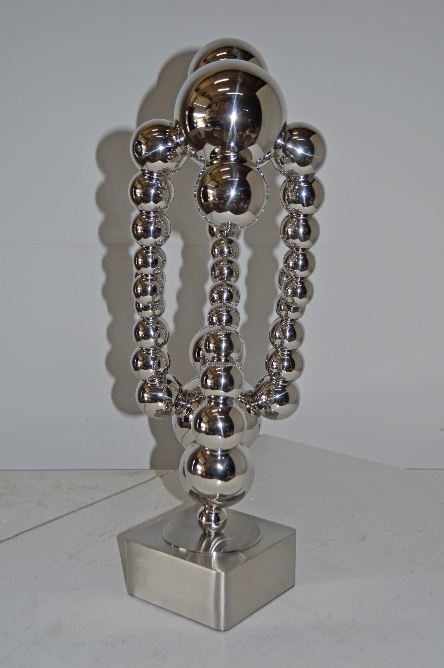 Modern Art Abstract Made of Chrome Balls Statue - Size: 11"L x 10"W x 22"H.
