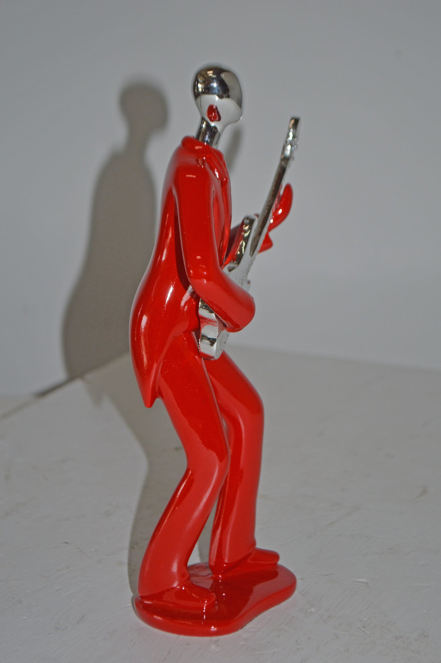 Modern Art Red and Chrome Man Playing Guitar Resin Statue - Size: 7" x 3" x 11"H