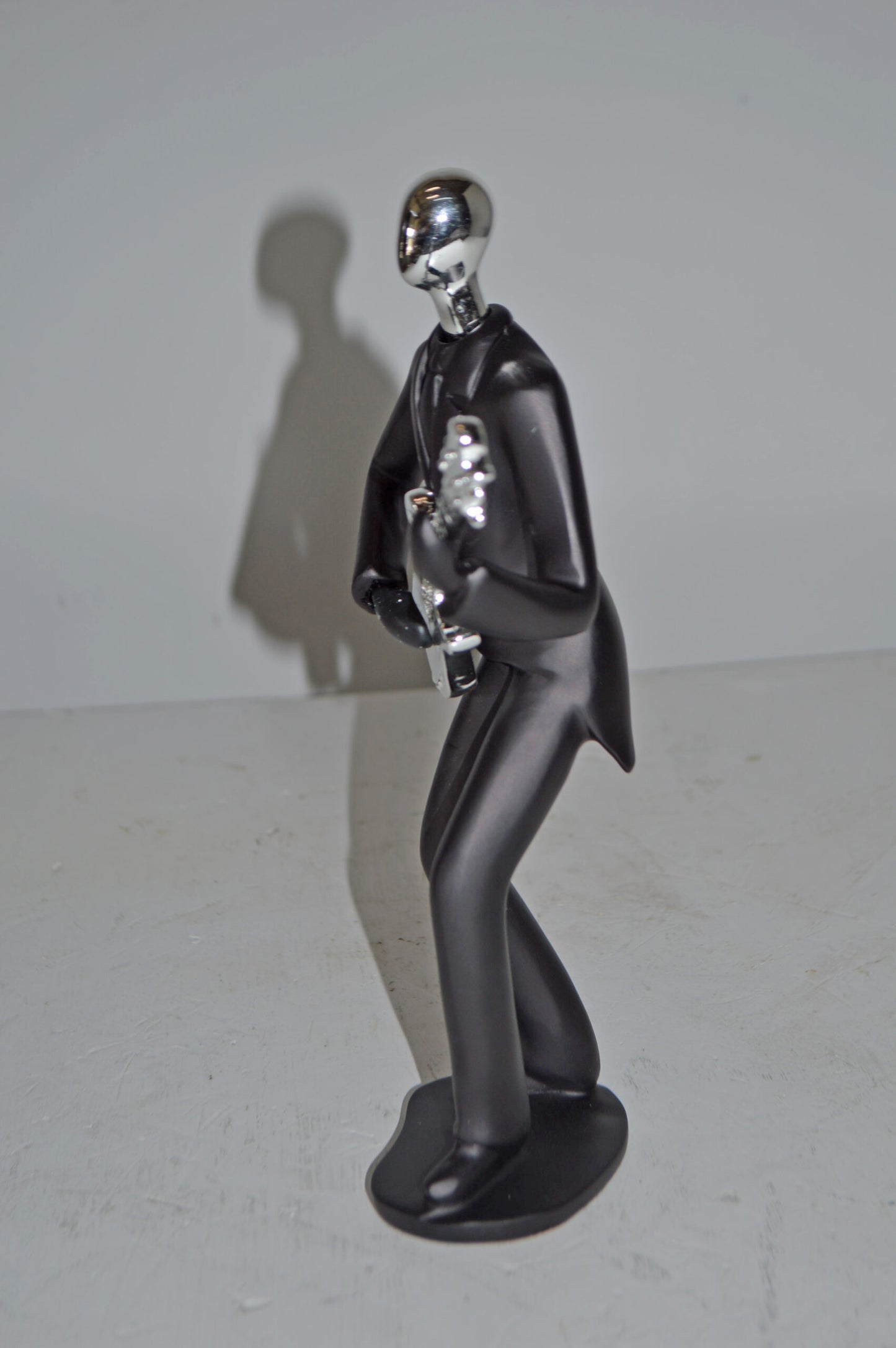 Modern Art Black and Chrome Man Playing Guitar Resin Statue - Size: 7"x3"x11"H