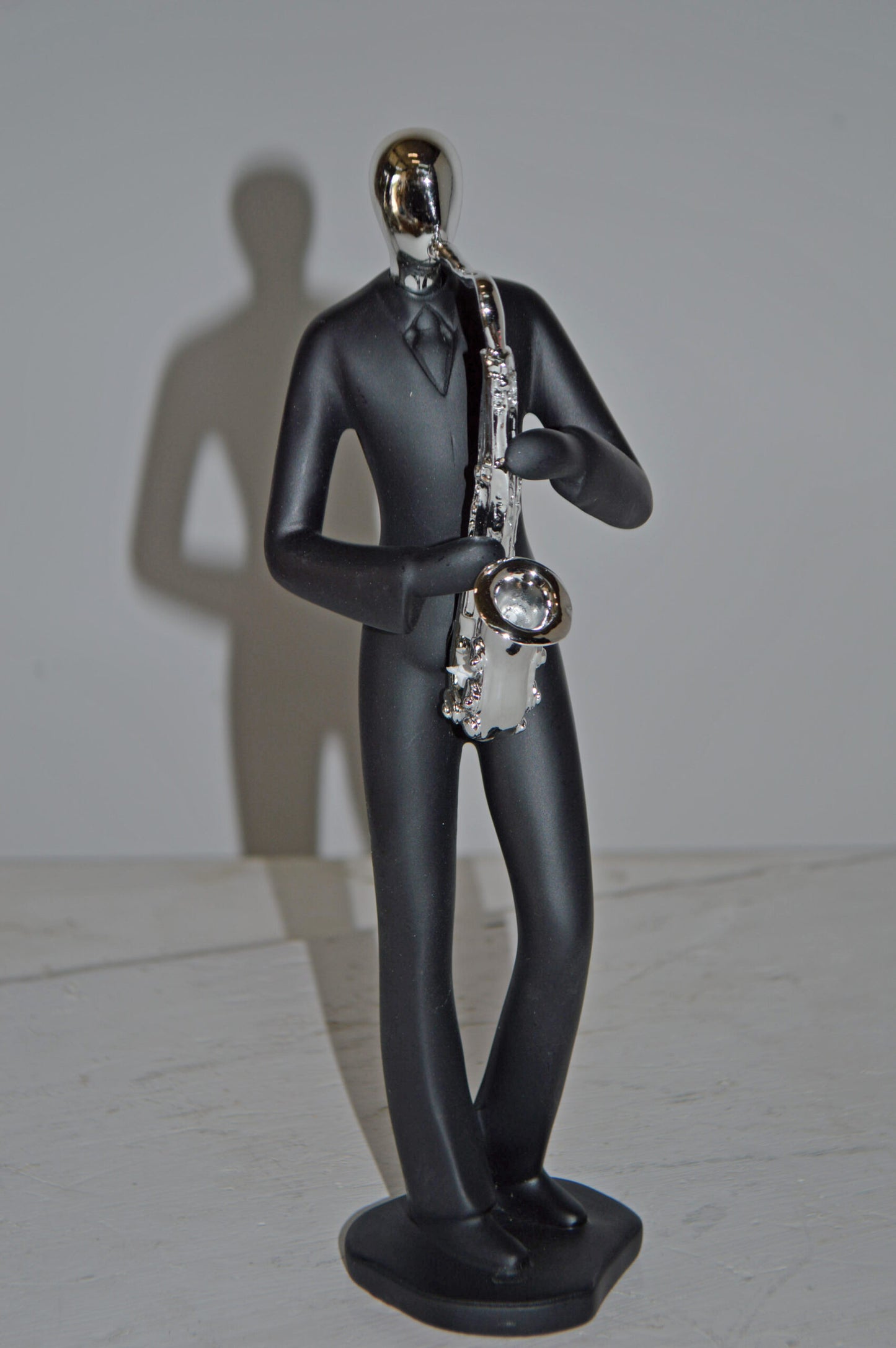 Modern Art Black and Chrome Man Play Saxophone Resin Statue - Size: 4"x3"x11"H
