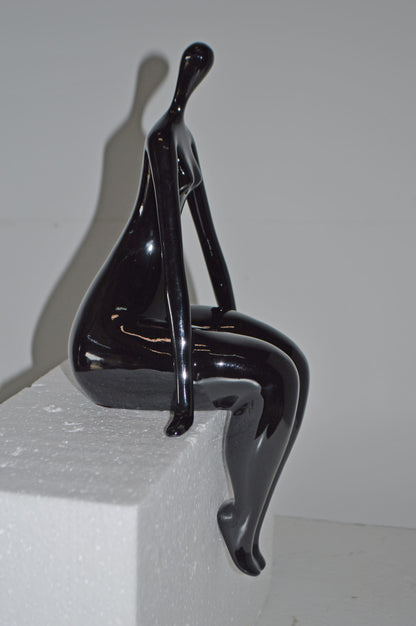 Modern Art Black Sitting on Edge Girl Made of Resin - Size: 8"L x 6"W x 15"H.