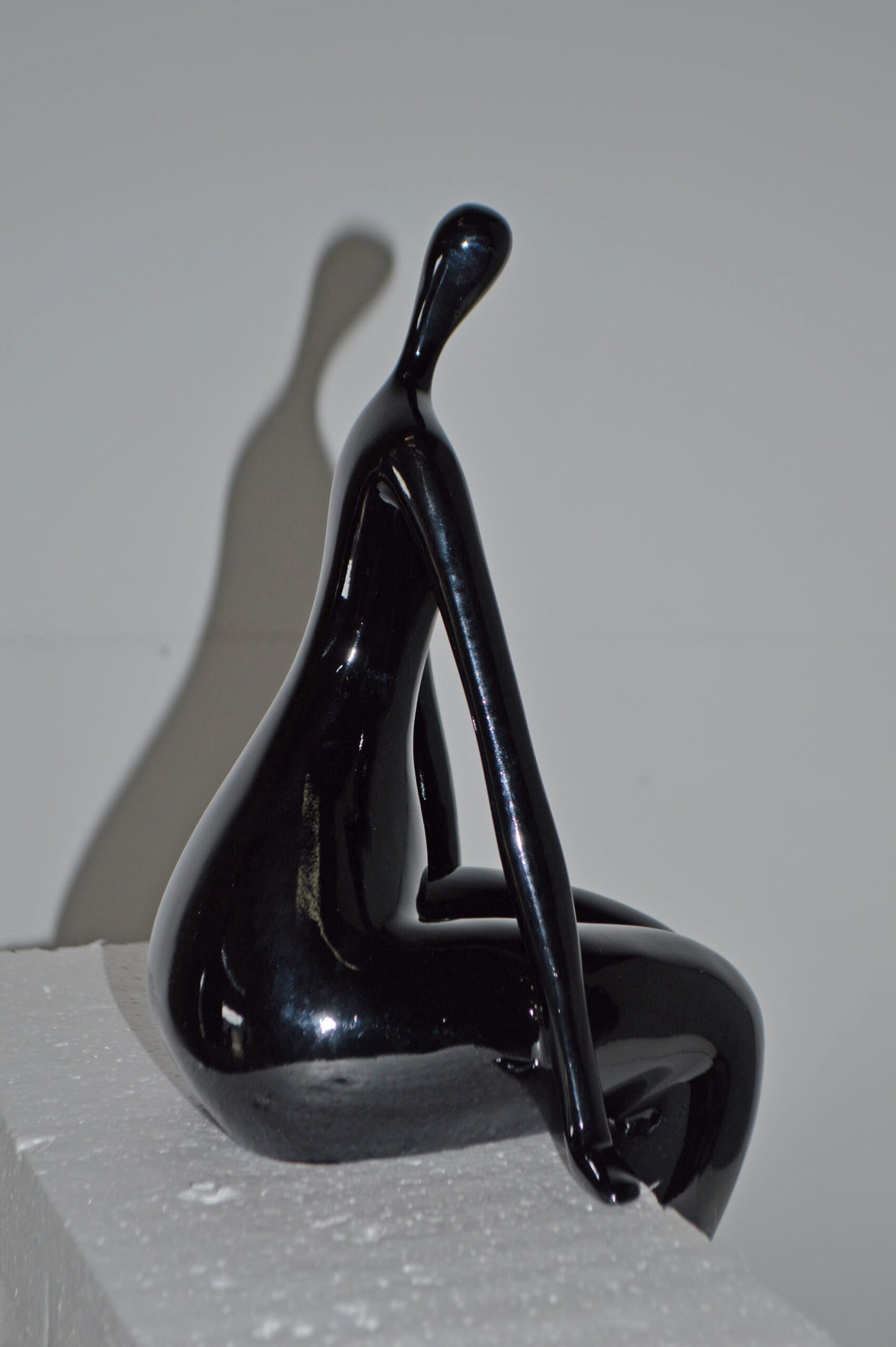 Modern Art Black Sitting on Edge Girl Made of Resin - Size: 8"L x 6"W x 15"H.