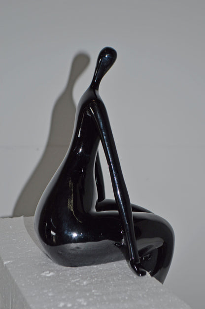 Modern Art Black Sitting on Edge Girl Made of Resin - Size: 8"L x 6"W x 15"H.