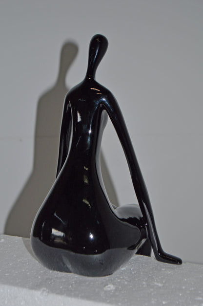 Modern Art Black Sitting on Edge Girl Made of Resin - Size: 8"L x 6"W x 15"H.