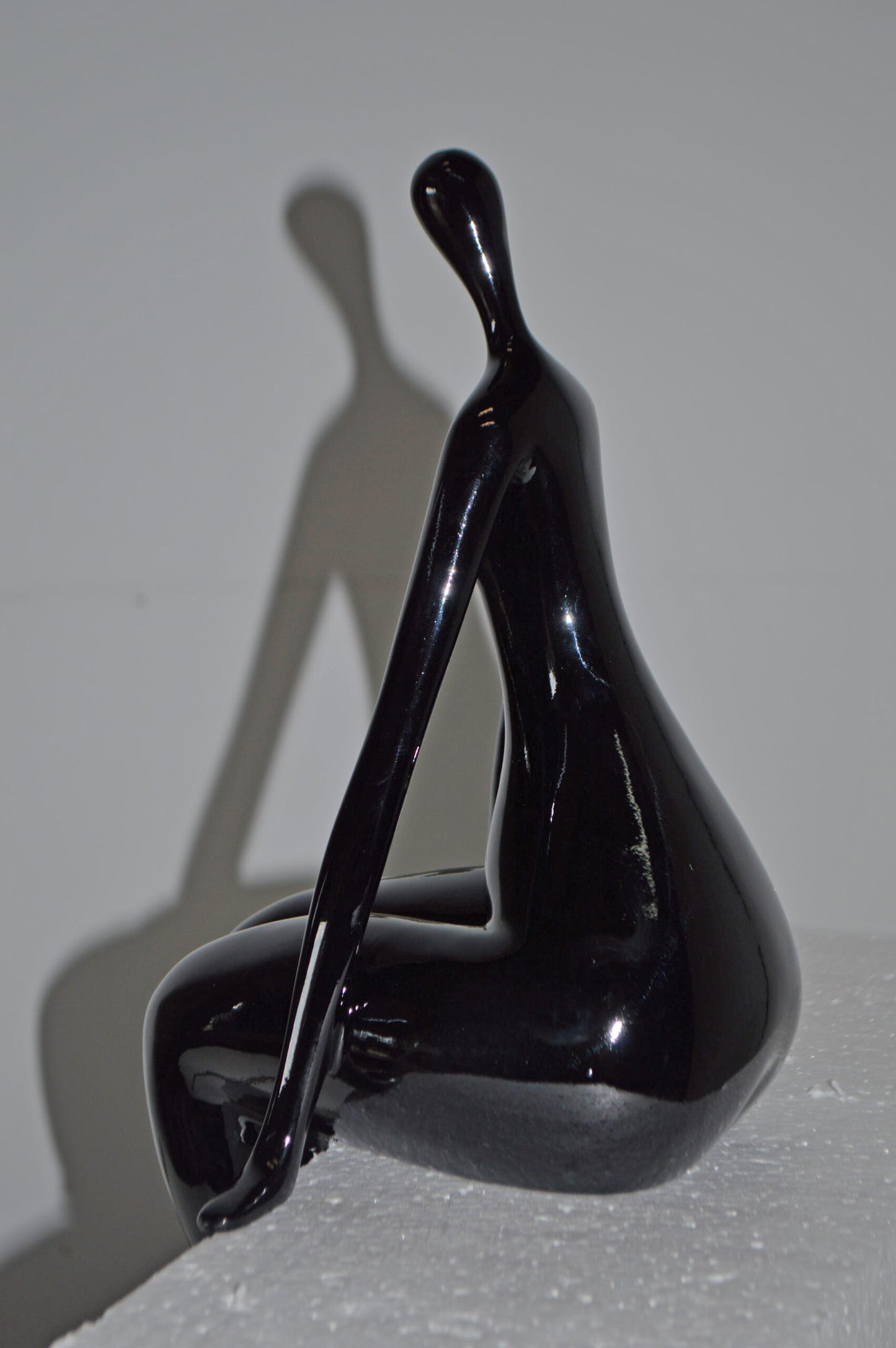 Modern Art Black Sitting on Edge Girl Made of Resin - Size: 8"L x 6"W x 15"H.
