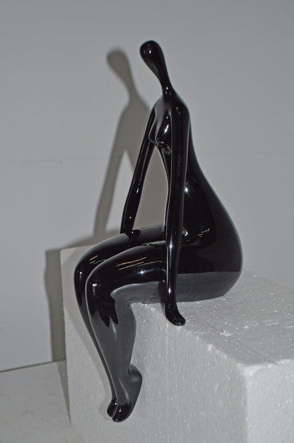 Modern Art Black Sitting on Edge Girl Made of Resin - Size: 8"L x 6"W x 15"H.