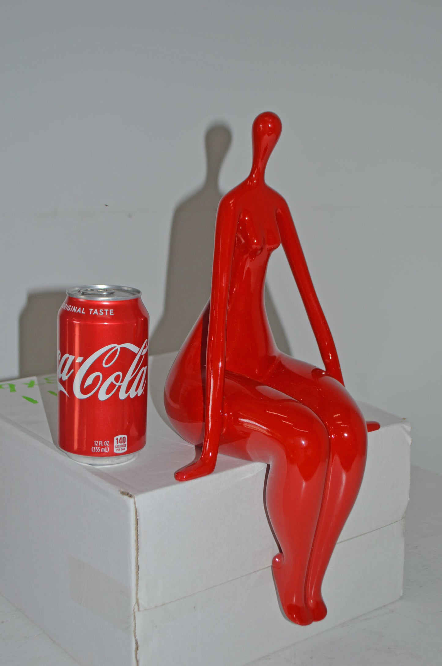 Modern Art Red Sitting on Edge Girl Made of Resin - Size: 8"L x 6"W x 15"H.