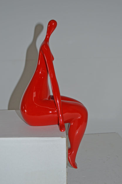 Modern Art Red Sitting on Edge Girl Made of Resin - Size: 8"L x 6"W x 15"H.