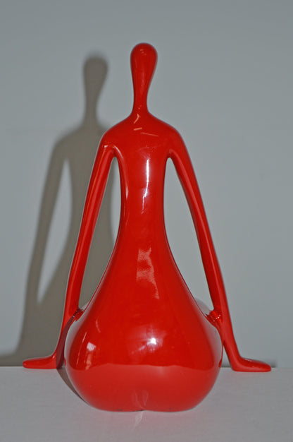 Modern Art Red Sitting on Edge Girl Made of Resin - Size: 8"L x 6"W x 15"H.