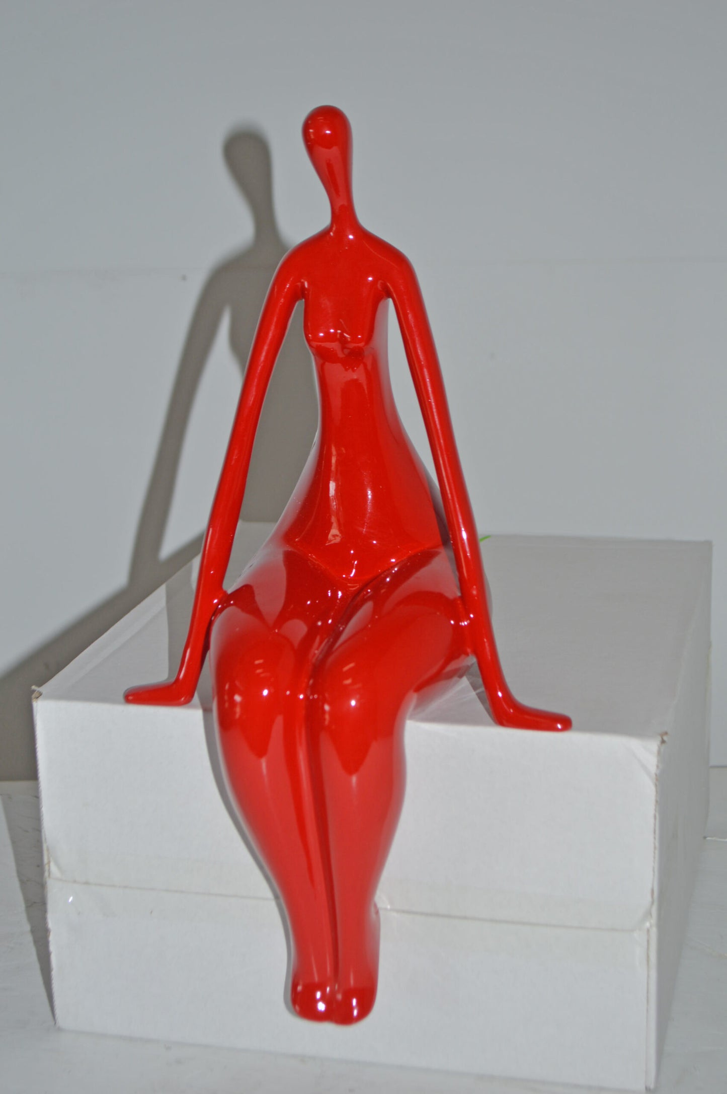 Modern Art Red Sitting on Edge Girl Made of Resin - Size: 8"L x 6"W x 15"H.