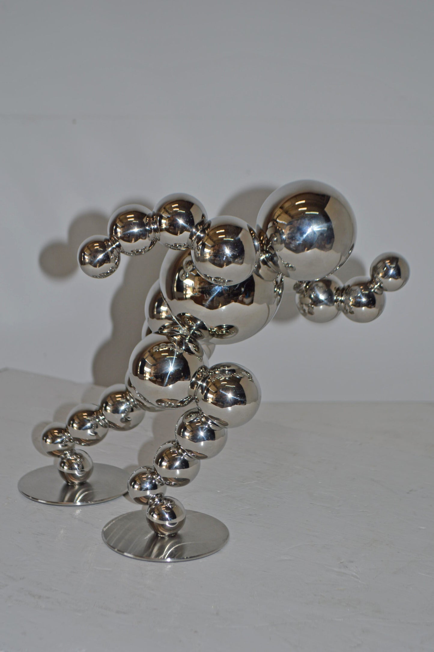 Modern Art Abstract of a Runner made of Chrome Balls - Size: 13"L x 9"W x 11"H.