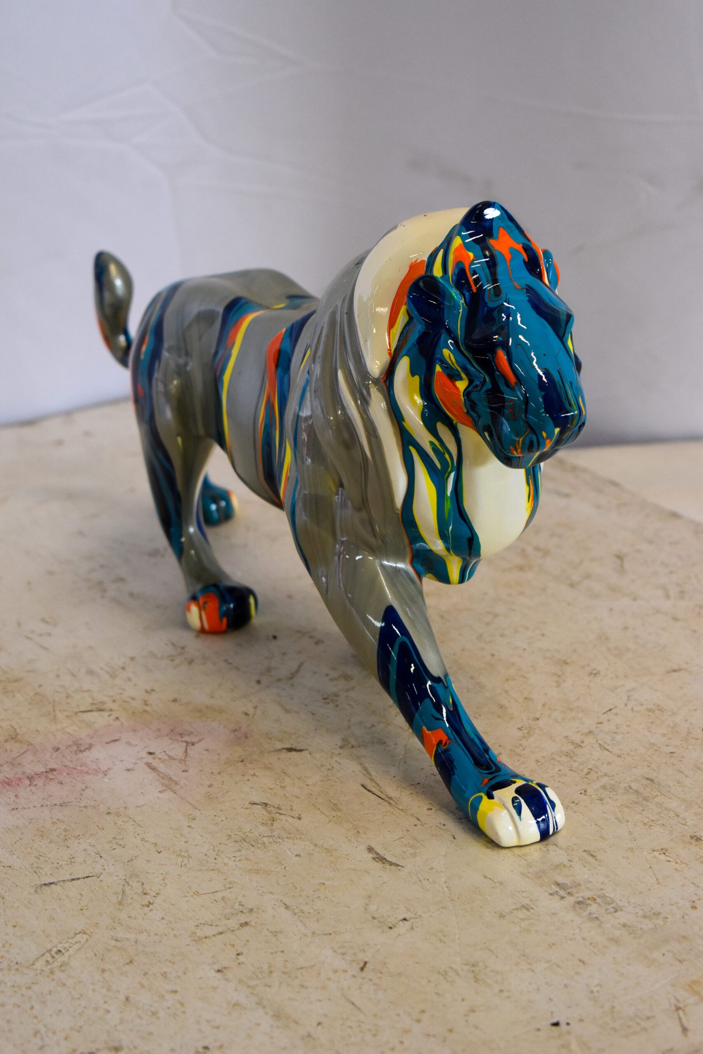 Roaming Multicolored Lion Resin Statue 19" x 5" x 9"H