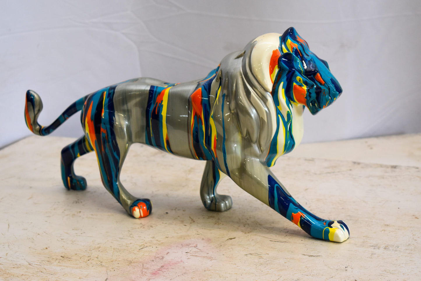 Roaming Multicolored Lion Resin Statue 19" x 5" x 9"H