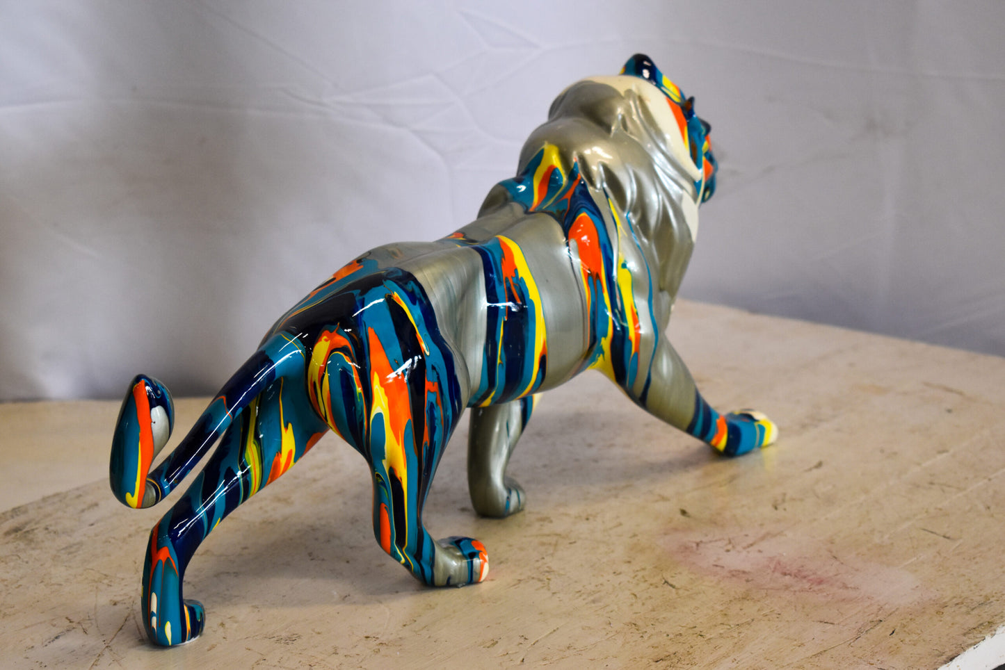 Roaming Multicolored Lion Resin Statue 19" x 5" x 9"H