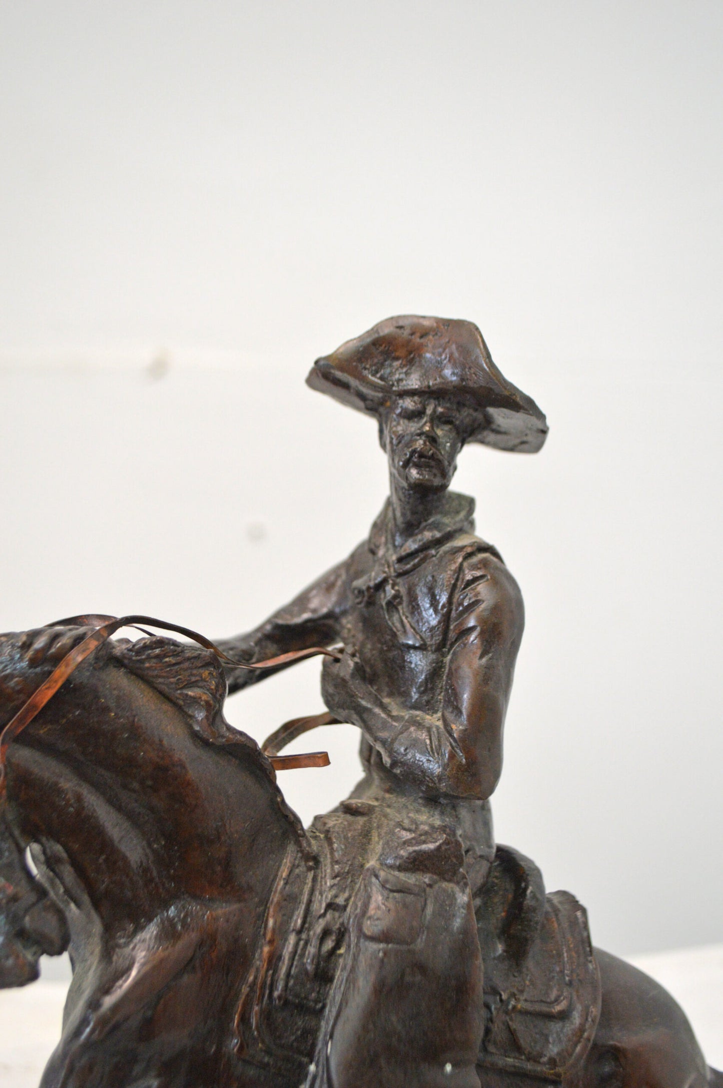 Cowboy, a Frederic Remington Replica Bronze Statue - Size: 14"L x 8"W x 13"H.