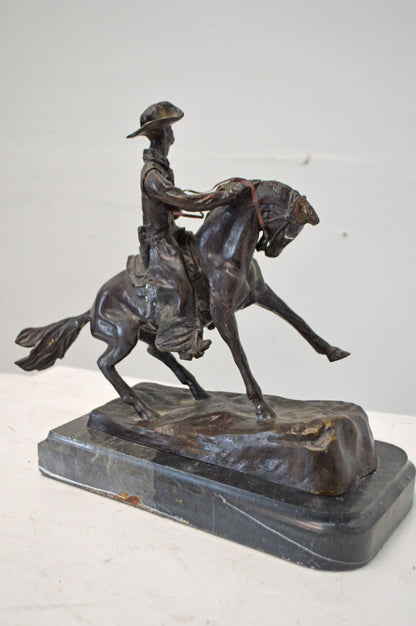 Cowboy, a Frederic Remington Replica Bronze Statue - Size: 14"L x 8"W x 13"H.