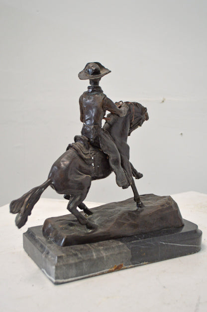 Cowboy, a Frederic Remington Replica Bronze Statue - Size: 14"L x 8"W x 13"H.