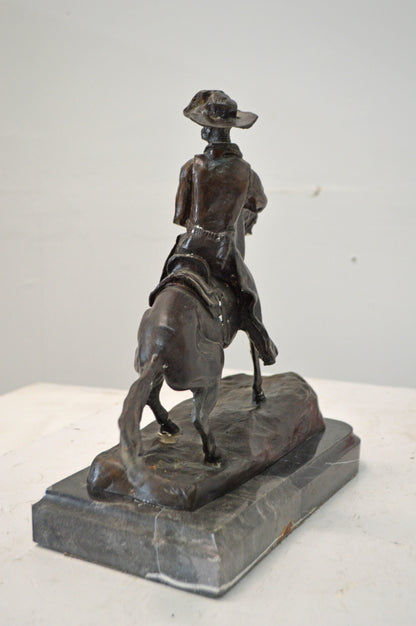 Cowboy, a Frederic Remington Replica Bronze Statue - Size: 14"L x 8"W x 13"H.