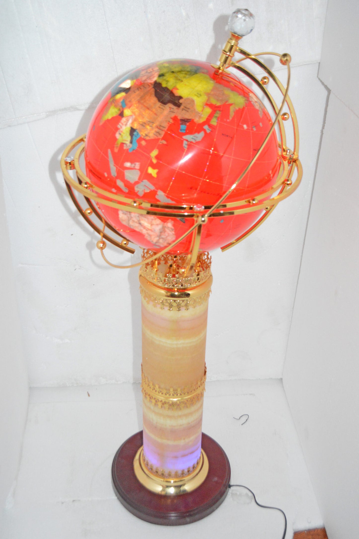 Illuminated Red - World Globe Rotated by a Motor - Size: 19"L x 19"W x 42"H.
