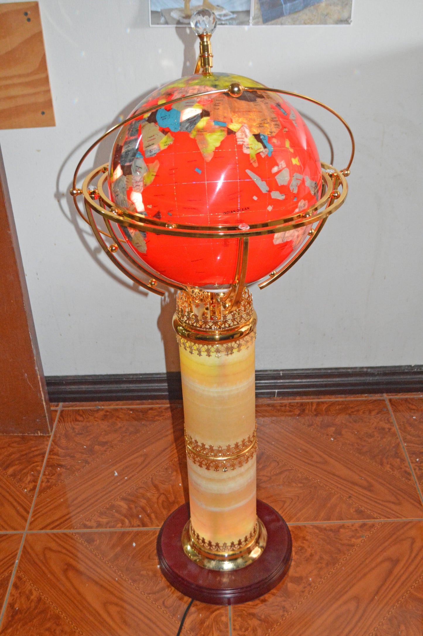 Illuminated Red - World Globe Rotated by a Motor - Size: 19"L x 19"W x 42"H.