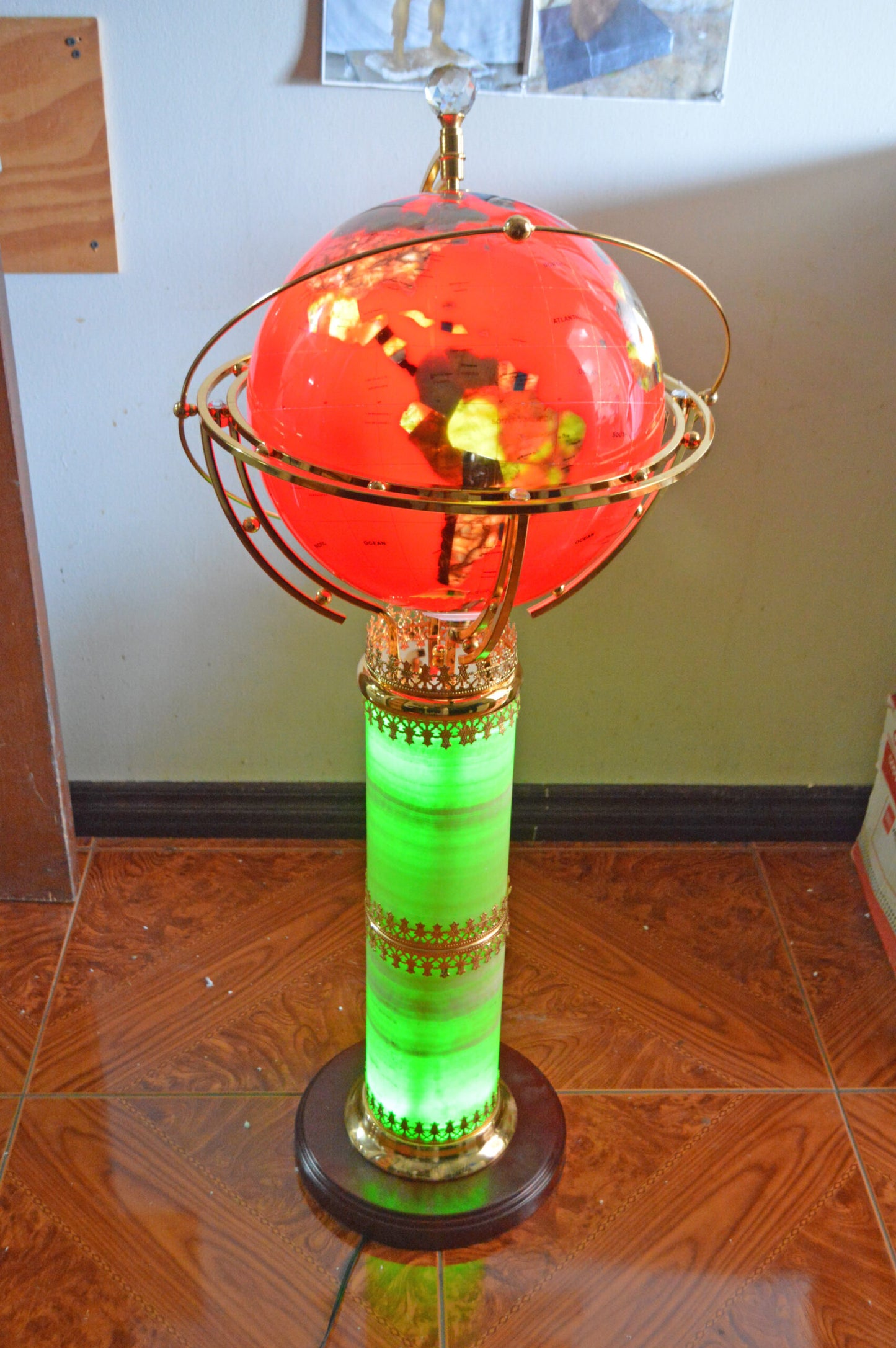 Illuminated Red - World Globe Rotated by a Motor - Size: 19"L x 19"W x 42"H.
