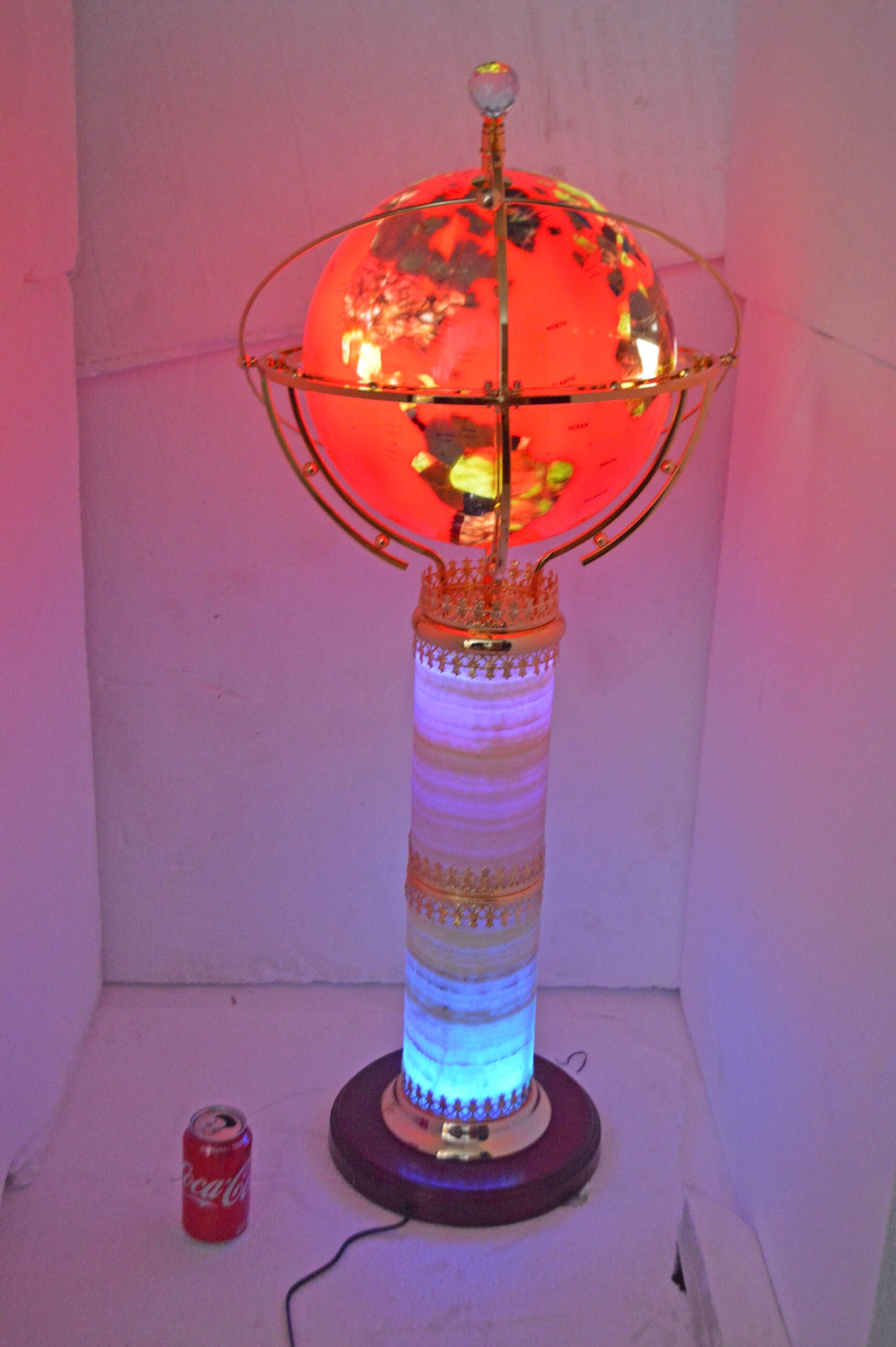 Illuminated Red - World Globe Rotated by a Motor - Size: 19"L x 19"W x 42"H.