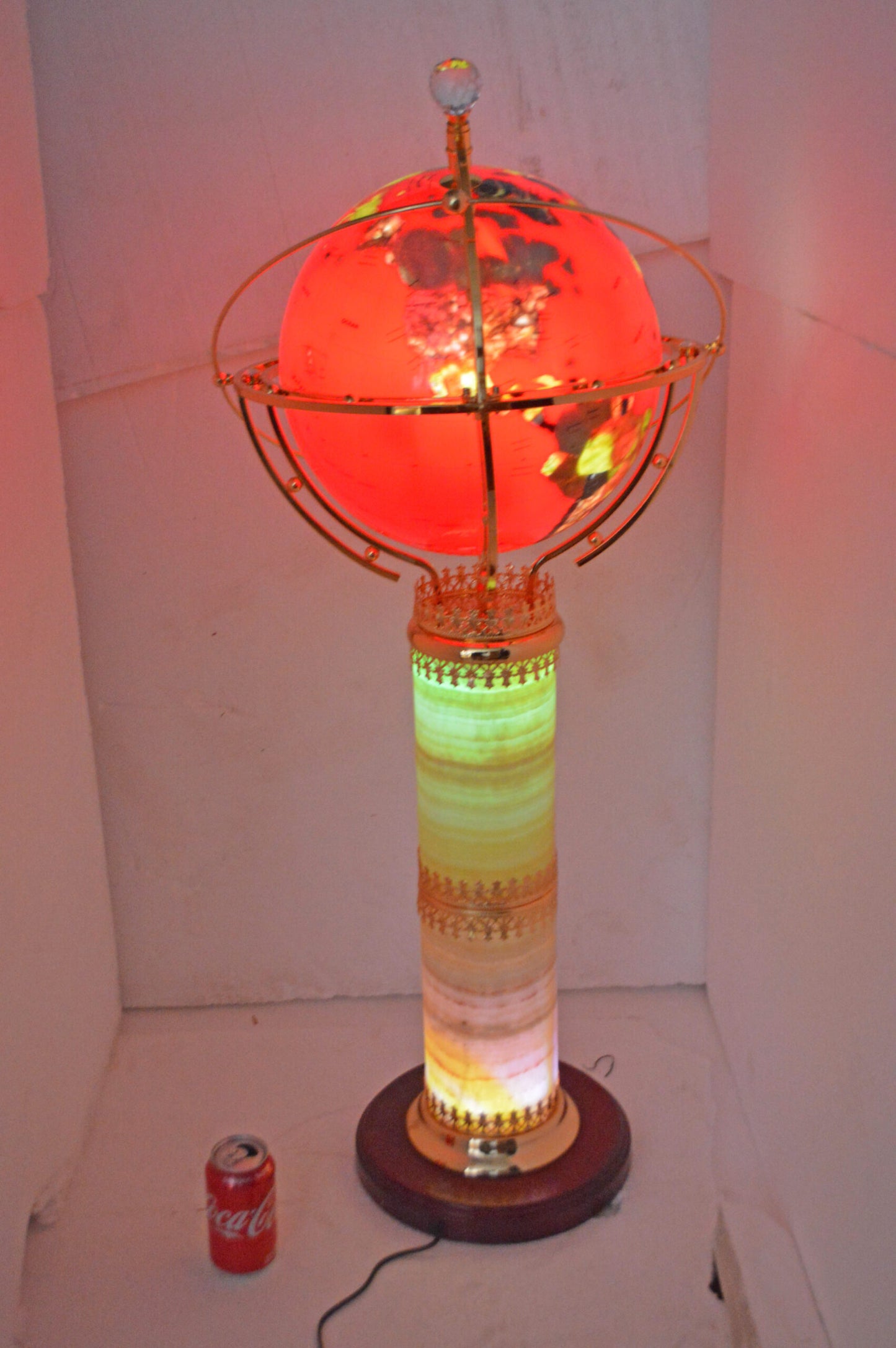 Illuminated Red - World Globe Rotated by a Motor - Size: 19"L x 19"W x 42"H.