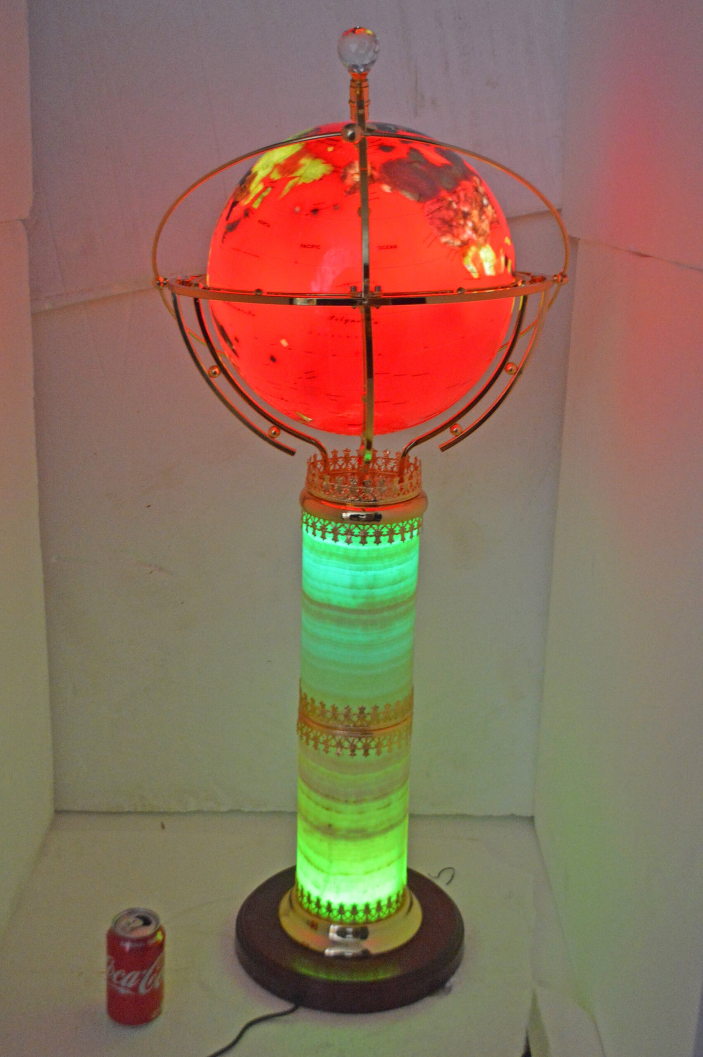 Illuminated Red - World Globe Rotated by a Motor - Size: 19"L x 19"W x 42"H.