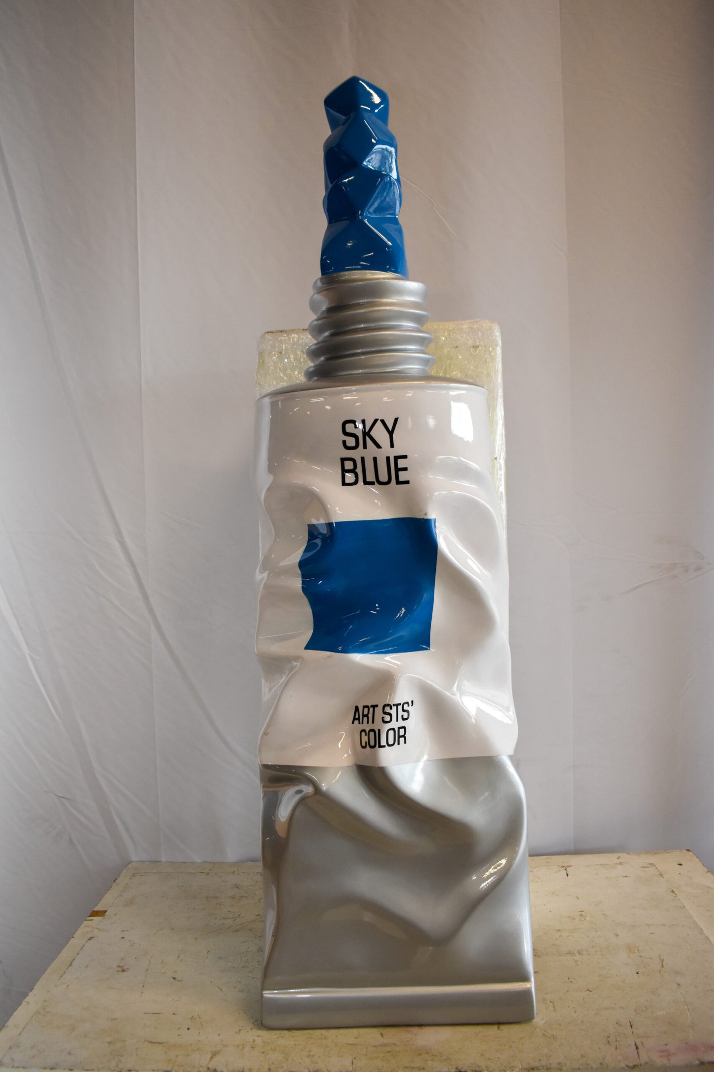 Oversized Wall Mounted Sky Blue Paint Tube Squezed Resin Statue 10" x 12" x 44"H