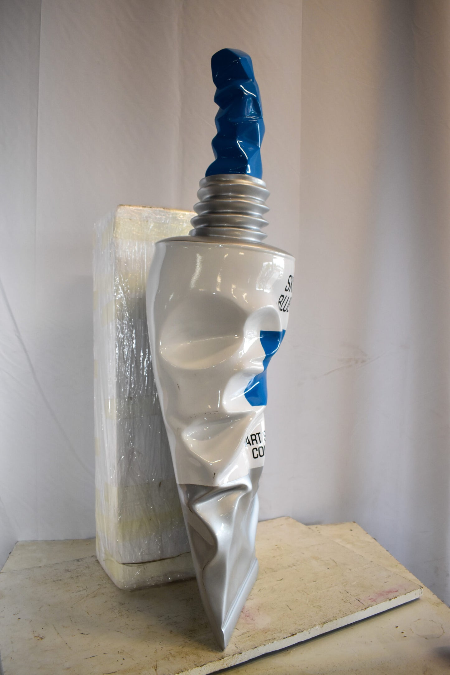 Oversized Wall Mounted Sky Blue Paint Tube Squezed Resin Statue 10" x 12" x 44"H