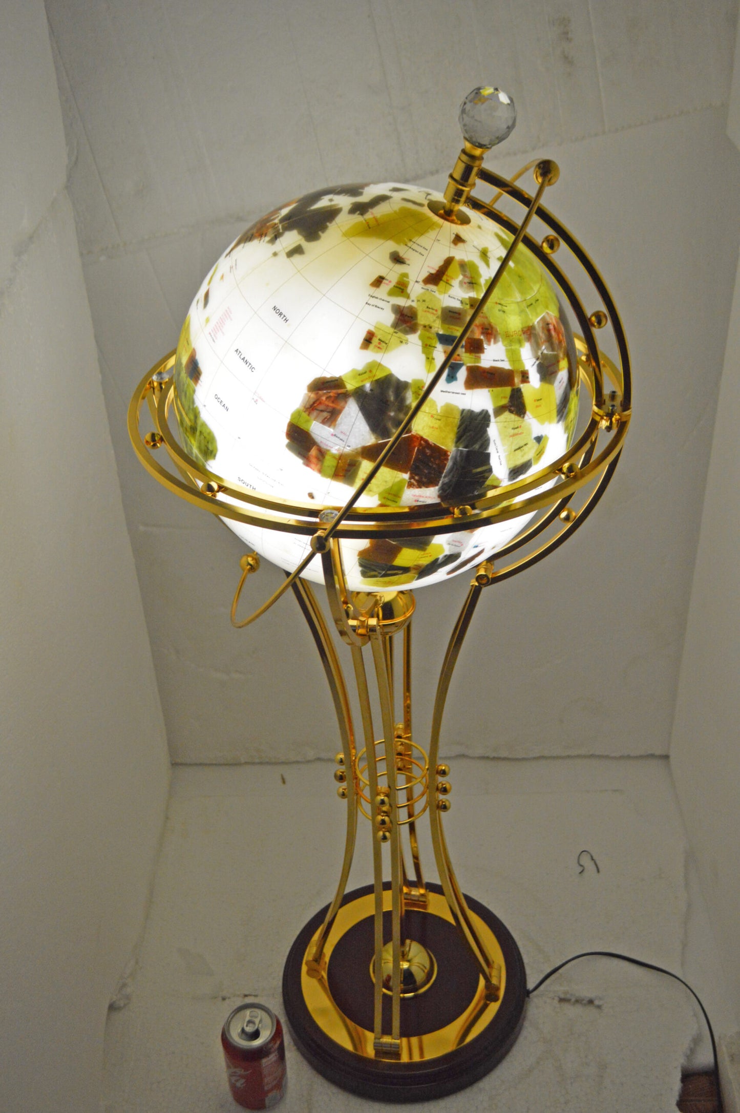 Illuminated White Gold World Globe Rotated by motor - Size: 19"L x 19"W x 42"H.
