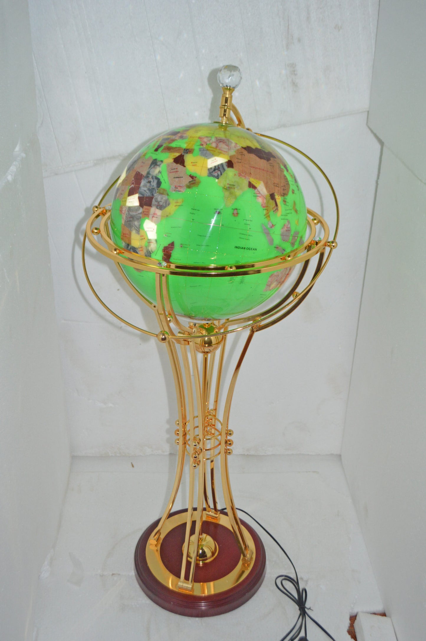 Illuminated Green - Gold World Globe Rotated by a motor - Size: 19" x 19" x 42"H