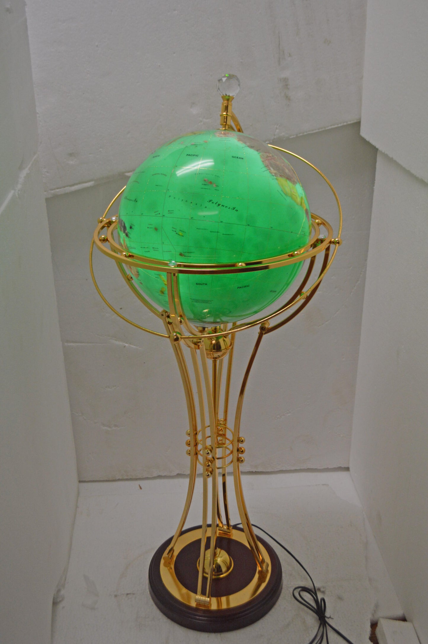 Illuminated Green - Gold World Globe Rotated by a motor - Size: 19" x 19" x 42"H