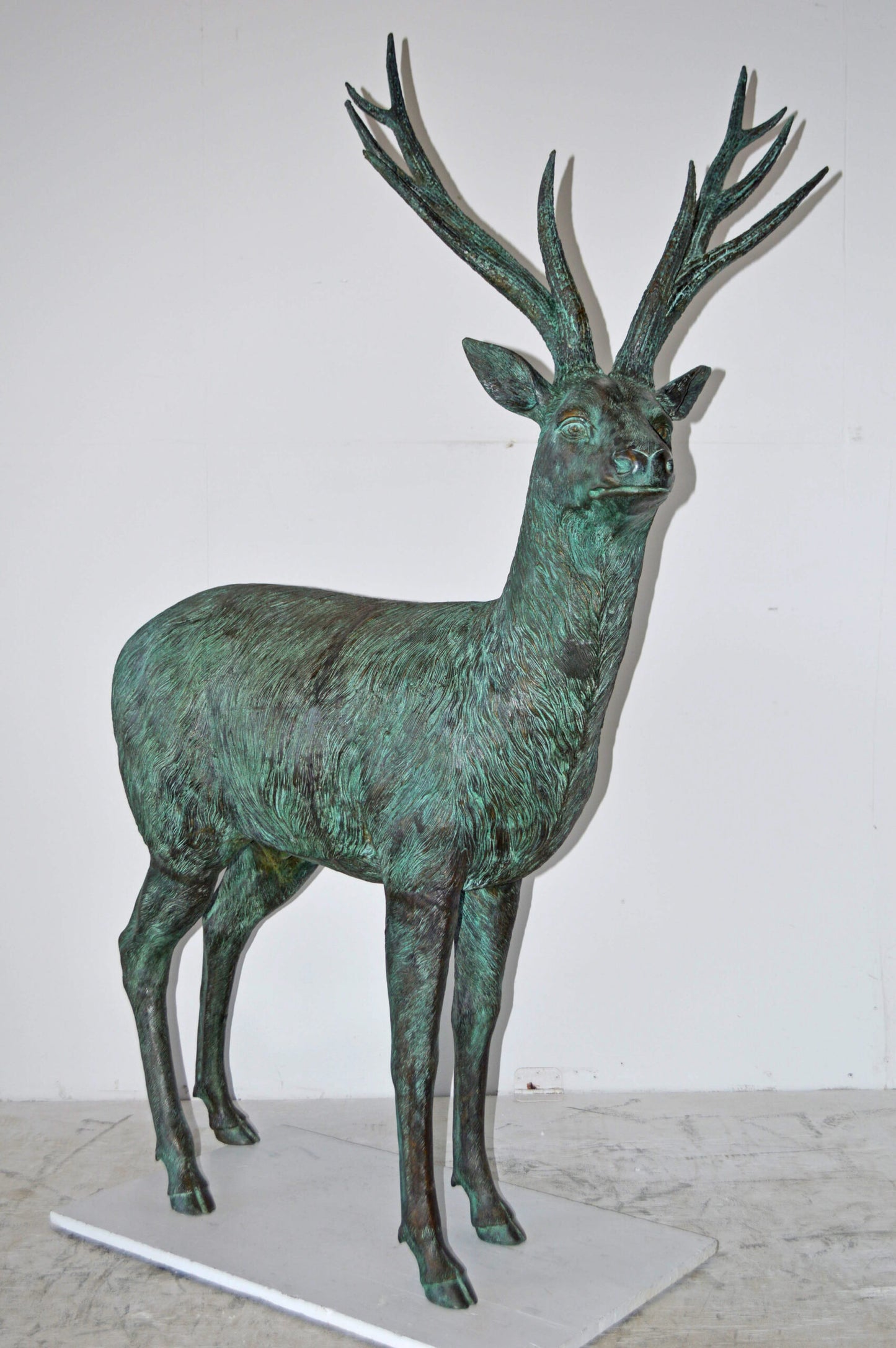 Pair of life size deer bronze statue with Green Patina - Size: 17" x 44" x 52"H.