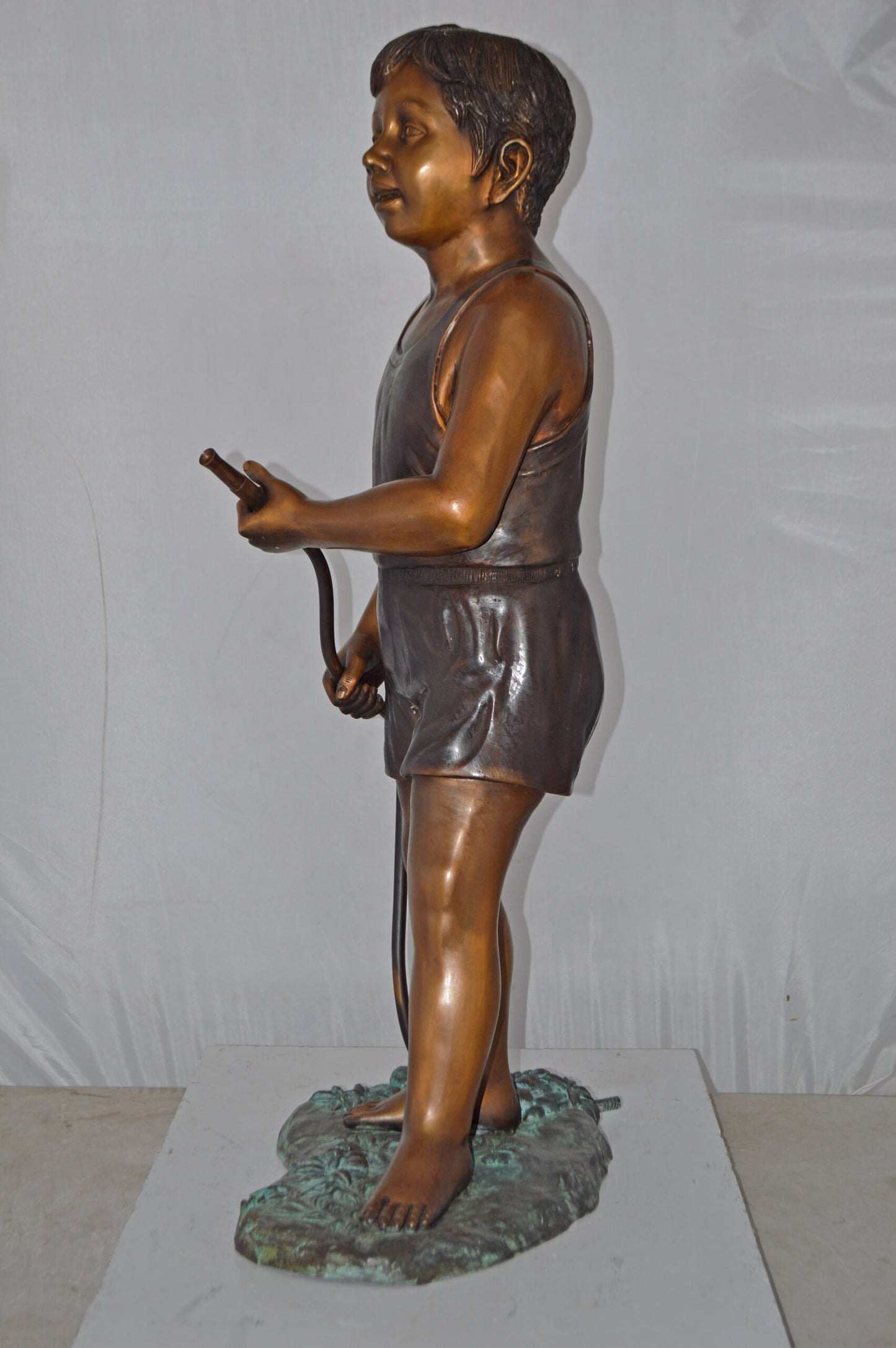 A Boy Holding A Garden Hose Bronze Statue Fountain - Size: 13"L x 20"W x 39"H.